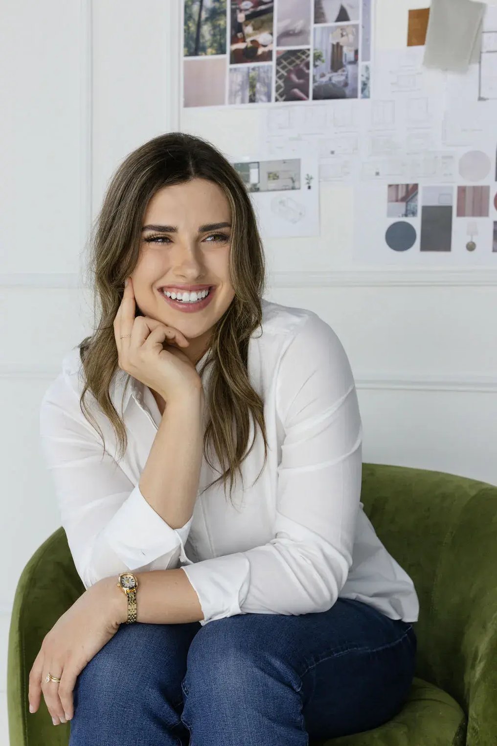 Career highlights section featuring a professional portrait of a marketing and interior design professional seated in a studio setting, with design boards, material samples, and project visuals behind her - representing expertise in branding, content creation, and award-winning design work.